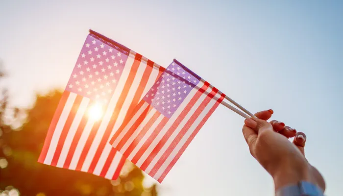 Handheld American flags.