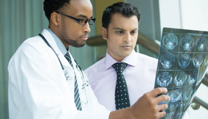 Doctors looking at x-rays